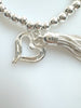 Beaded Silvery Alloy Bracelet With Dangling Heart And Tassel