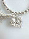 Beaded Silvery Bracelet With Dangling Wing And Tassel