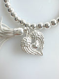 Beaded Silvery Bracelet With Dangling Wing And Tassel