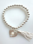 Beaded Silvery Bracelet With Dangling Wing And Tassel