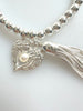 Beaded Silvery Bracelet With Dangling Wing And Tassel