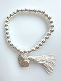 Beaded Silvery Bracelet With Dangling Wing And Tassel
