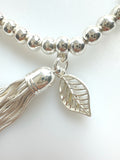 Beaded Alloy Bracelet With Dangling Bits