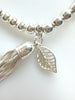 Beaded Alloy Bracelet With Dangling Bits