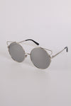 Round Sunglasses with darker tint in light frame